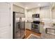Modern kitchen features stainless steel appliances and ample cabinet space at 2804 Barmettler St, Raleigh, NC 27607