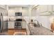 Well-appointed kitchen featuring stainless steel appliances, granite countertops, and ample cabinet space at 2804 Barmettler St, Raleigh, NC 27607