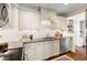 Updated kitchen featuring granite countertops, white subway tile backsplash, and stainless steel appliances at 2804 Barmettler St, Raleigh, NC 27607