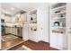 Bright kitchen with stainless steel appliances and beautiful built-in shelving at 2804 Barmettler St, Raleigh, NC 27607