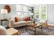 Comfortable living room featuring large windows, natural light, and stylish furnishings at 2804 Barmettler St, Raleigh, NC 27607