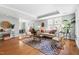Bright and airy living room with hardwood floors, a cozy rug, comfortable seating, and an open layout at 2804 Barmettler St, Raleigh, NC 27607