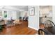 Open-concept living space with hardwood floors and an adjacent kitchen at 2804 Barmettler St, Raleigh, NC 27607