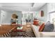 Bright living room with hardwood floors open to a dining area at 2804 Barmettler St, Raleigh, NC 27607