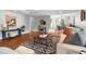 Open living room showcasing hardwood floors, area rug, and neutral wall paint at 2804 Barmettler St, Raleigh, NC 27607