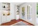 Home office with door to outdoor porch and backyard, and convenient built-ins at 2804 Barmettler St, Raleigh, NC 27607