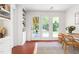 Bright office featuring tile floors, built-in bookshelves, and access to the covered porch at 2804 Barmettler St, Raleigh, NC 27607