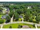 Aerial view of home in neighborhood surrounded by mature trees at 3109 Gold Dust Ln, Willow Springs, NC 27592