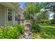 Backyard view of patio with steps leading to deck and well-manicured lawn at 3109 Gold Dust Ln, Willow Springs, NC 27592