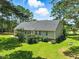 Back of house featuring a deck, back door, and lawn at 3109 Gold Dust Ln, Willow Springs, NC 27592