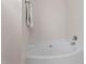 Clean and simple bathtub with a white finish and chrome fixtures at 3109 Gold Dust Ln, Willow Springs, NC 27592