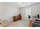 Comfortable bedroom with a wooden dresser, desk, and natural light from the window at 3109 Gold Dust Ln, Willow Springs, NC 27592