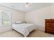 Cozy bedroom with neutral colors, plush carpeting, and a bright window that provides natural light at 3109 Gold Dust Ln, Willow Springs, NC 27592