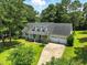 Charming house with a two-car garage, and a well-manicured lawn at 3109 Gold Dust Ln, Willow Springs, NC 27592