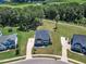 Beautiful neighborhood aerial view showcasing meticulously maintained yards and mature trees at 326 S Parliament Way, Clayton, NC 27520