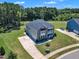 Aerial view of a beautiful home with a well-maintained yard, showcasing its curb appeal and landscaping at 326 S Parliament Way, Clayton, NC 27520