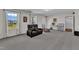 Basement features workout equipment, seating, and a desk at 326 S Parliament Way, Clayton, NC 27520