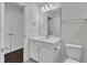 Bathroom features a vanity with white cabinets and a toilet at 326 S Parliament Way, Clayton, NC 27520