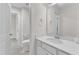 Bright bathroom featuring a white vanity and updated fixtures and toilet at 326 S Parliament Way, Clayton, NC 27520