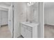 Bathroom with white vanity, updated fixtures, and combination shower/tub at 326 S Parliament Way, Clayton, NC 27520