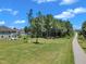 An aerial view of a paved community path running along backyards of homes at 326 S Parliament Way, Clayton, NC 27520
