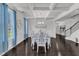 Dining room showcasing a coffered ceiling, chandelier, and a large window at 326 S Parliament Way, Clayton, NC 27520