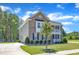 Charming two-story brick home with a driveway and a well-manicured lawn and landscaping at 326 S Parliament Way, Clayton, NC 27520
