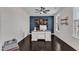 Modern home office with a stylish desk, decorative maps, and a ceiling fan at 326 S Parliament Way, Clayton, NC 27520