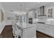 Gourmet kitchen with an open floor plan, large island, stainless appliances, and plenty of counter space at 326 S Parliament Way, Clayton, NC 27520