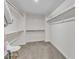 Spacious walk-in closet with ample shelving and a chair at 326 S Parliament Way, Clayton, NC 27520