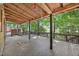 Large back deck overlooking a yard with lush green trees at 3263 S Jim Minor Rd Rd, Haw River, NC 27258