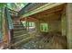The rear of the house showcasing the deck and access to the backyard at 3263 S Jim Minor Rd Rd, Haw River, NC 27258