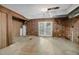 Unfinished basement featuring brick walls and a walkout door to the back yard at 3263 S Jim Minor Rd Rd, Haw River, NC 27258