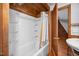 This bathroom features a white tub, a shower, and wooden accents throughout at 3263 S Jim Minor Rd Rd, Haw River, NC 27258