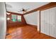 Bedroom featuring hardwood floors, exposed beams, and a closet for storage at 3263 S Jim Minor Rd Rd, Haw River, NC 27258