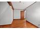 This bedroom features hardwood floors and neutral painted walls at 3263 S Jim Minor Rd Rd, Haw River, NC 27258