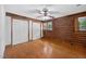 Bright bedroom with hardwood floors, two closets and wood-paneled accent walls at 3263 S Jim Minor Rd Rd, Haw River, NC 27258