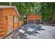 Log cabin style garage with convenient two-door access and charming exterior details at 3263 S Jim Minor Rd Rd, Haw River, NC 27258