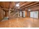 Open-concept living area with hardwood flooring, stairs, and access to other rooms at 3263 S Jim Minor Rd Rd, Haw River, NC 27258