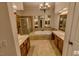Large bathroom featuring double sinks, a jetted tub, and a separate shower stall at 332 Bridgegate Dr, Cary, NC 27519