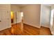 Bedroom with hardwood flooring and a view of the attached bathroom at 332 Bridgegate Dr, Cary, NC 27519