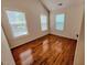Bright bedroom with hardwood floors and natural light from the windows at 332 Bridgegate Dr, Cary, NC 27519