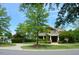 Inviting community clubhouse with well-manicured landscaping, enhancing curb appeal at 332 Bridgegate Dr, Cary, NC 27519