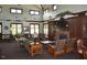 Cozy clubhouse interior with a fireplace, comfortable seating, and ample natural light at 332 Bridgegate Dr, Cary, NC 27519