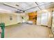 Spacious garage with overhead storage and workshop area, offering ample space for vehicles and projects at 332 Bridgegate Dr, Cary, NC 27519