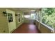 Screened patio with wood flooring and backyard view at 332 Bridgegate Dr, Cary, NC 27519