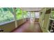 Screened patio with wood flooring and backyard view at 332 Bridgegate Dr, Cary, NC 27519