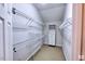 Well-organized walk-in closet with adjustable shelving and built-in drawers for ample storage at 332 Bridgegate Dr, Cary, NC 27519