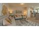 Bright living room with a modern rug, contemporary art, and comfortable sofas for relaxation at 366 Church St # 58, Wendell, NC 27591