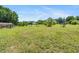 Expansive backyard with a well-maintained lawn, garden, and mature trees at 3831 Abattoir Rd, Angier, NC 27501